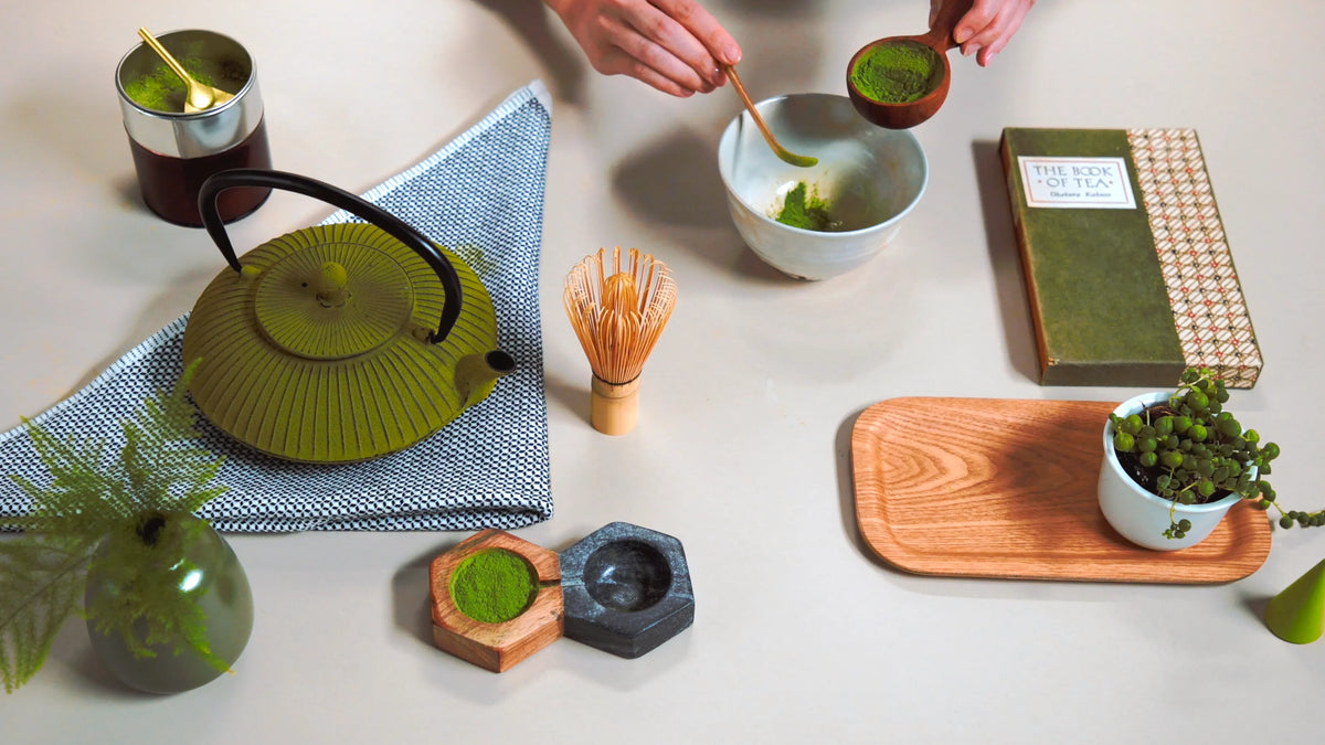 Add two bamboo scoops of matcha into the bowl (2 g, or 1/2 a teaspoon).
