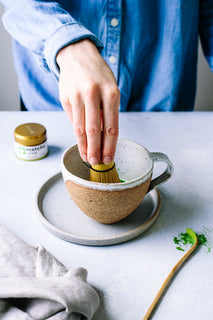 Ceremonial matcha love matcha powder being whisked 